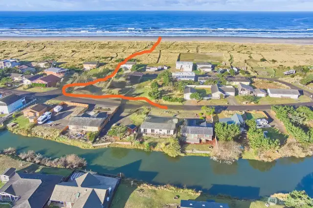 The public beach trail is just a block to the west...