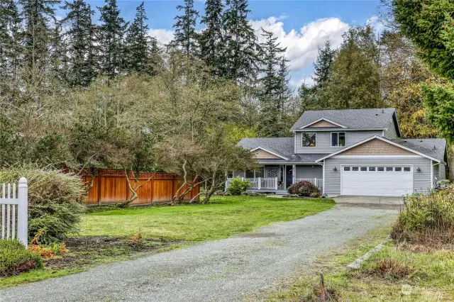 The home is set back from the street on a large lot.