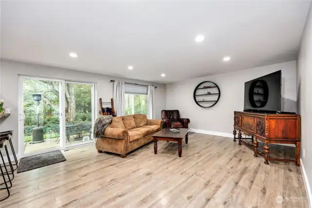 A family room that leads you to the back patio.