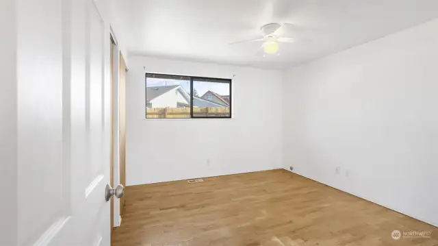 Bedroom #3 of 3: again, hardwood floors and fresh interior paint, and ceiling fan is nice during the warm summer days!