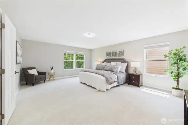 Retreat to the luxurious primary bedroom, complete with plush new carpet, neutral tones, and expansive windows. There's ample room for a sitting area or home office setup—your personal haven to unwind in peace and privacy.