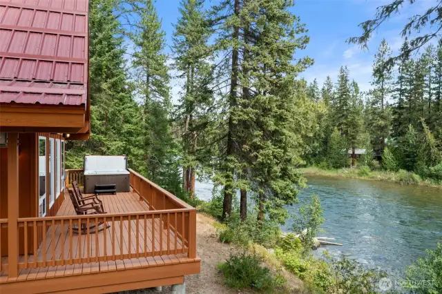 Chalet front deck and river.