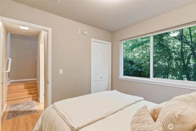 Lower-level retreat featuring its own bathroom, making it a private space.