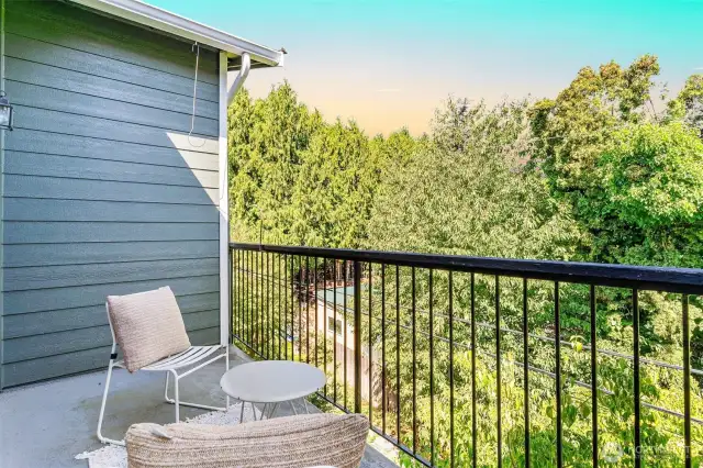 Outdoor retreat with room for seating, directly accessible from the primary suite.