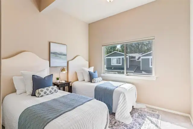 Updated upper bedroom with vaulted ceilings and new carpet.
