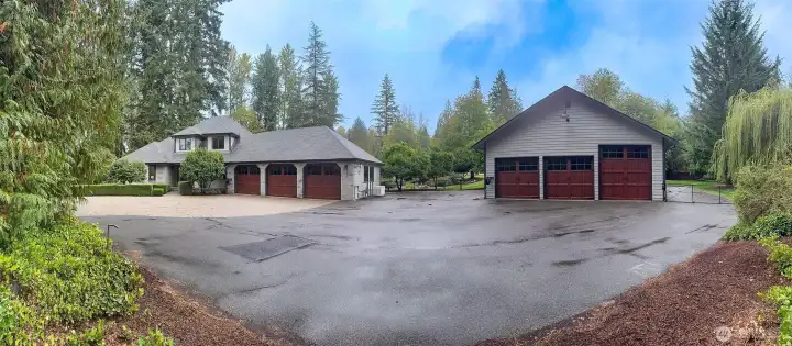 This amazing house and shop is framed by 2 acres of established, professional landscape.