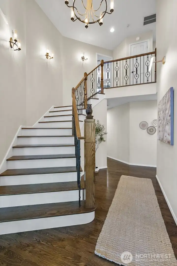 Exquisite custom stairway with ironwork from Italy.