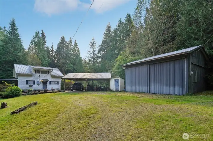 Notice the proximity of the home, the covered parking with metal roof and the very large shop 24x24 with a loft.  Thinking of farming?