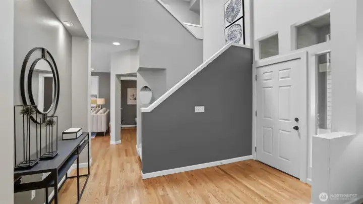 As soon as you enter this stylish home the vaulted ceilings give you the feeling of a well designed and built home. Real hardwood floors are throughout the main level w/the exception of the utility and one closet.