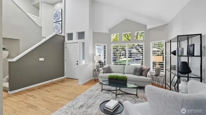 A broad view looking back towards the front door.  6 panel doors and white millwork adorn much of the home.