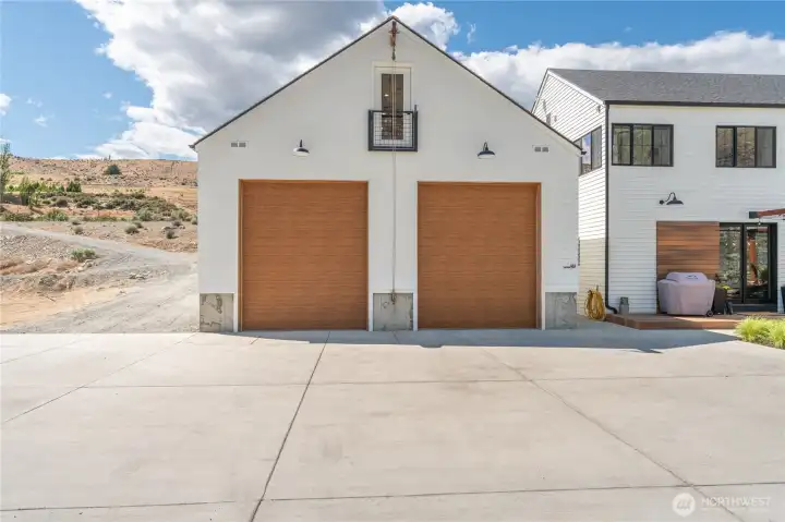 12 ft garage doors on the 900 sq ft detached garage. Driveway is now paved with asphalt.