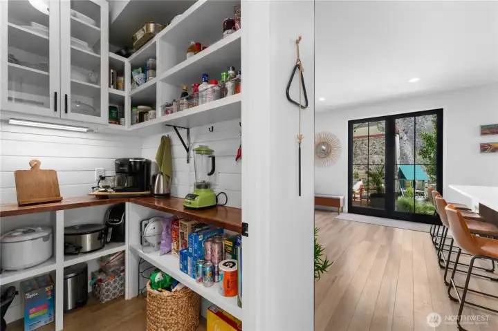 Pantry with plenty of storage just off the kitchen.