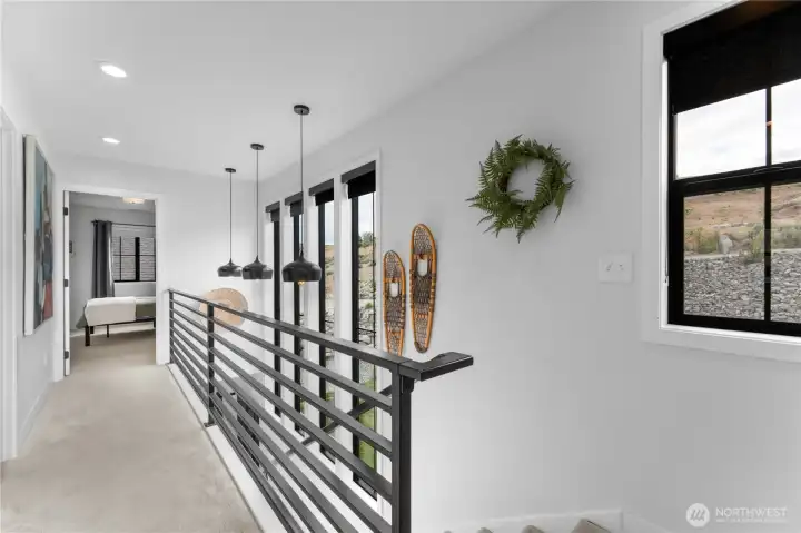 10 ft tall windows over looking the street side of the home. Custom metal railing.