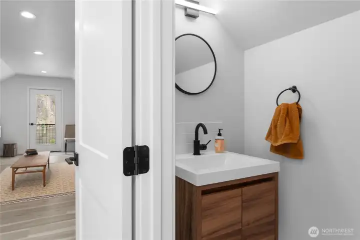 Half bath in the bonus room above garage.