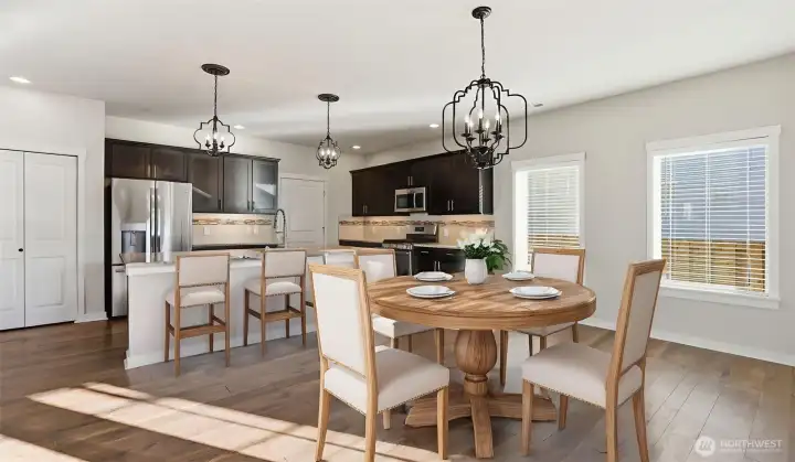 Kitchen and dining area with French doors leading to the backyard oasis. (virtually staged).
