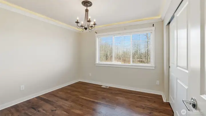 Bedroom on upper level offers inlaid lighting.