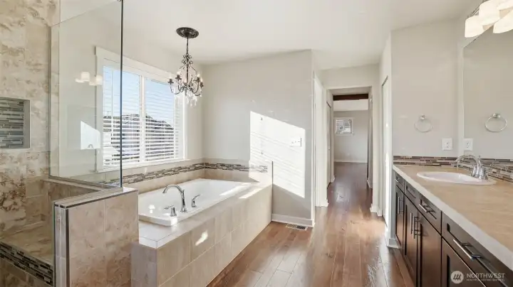 Chandelier-lit soaking tub.