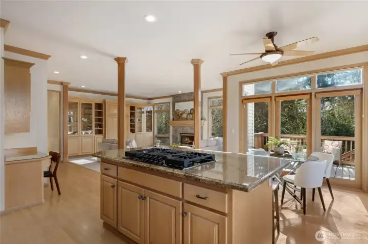 Open-concept kitchen with center island and seamless flow into the family room.