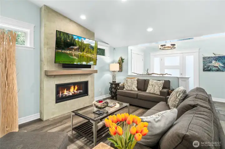 Spacious living area with modern fireplace, recessed lighting, and clean contemporary finishes designed for comfort and easy living.
