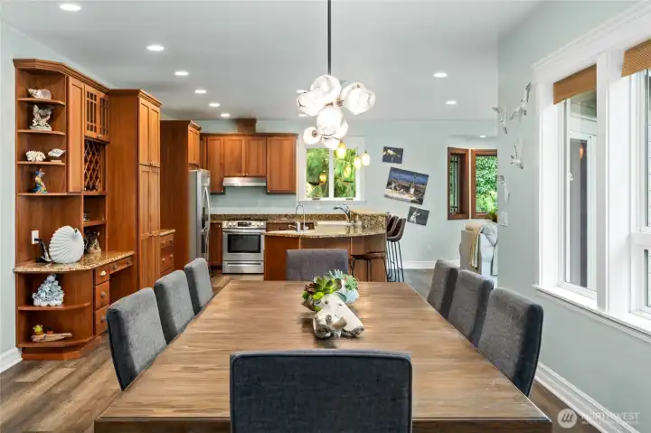 Bright open-concept dining and kitchen layout, ideal for entertaining and everyday living with seamless flow between gathering spaces.