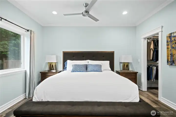 Large primary suite with ample natural light and easy flow to the en-suite bathroom and walk-in closet.