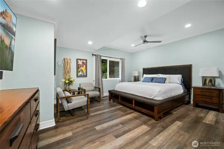 Generous primary suite retreat offers space for a sitting area, reading nook, or relaxation space.