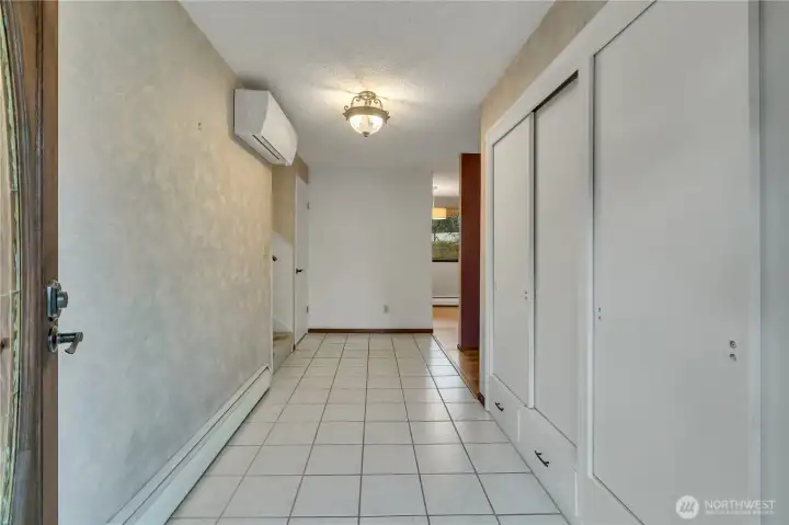 Bright and welcoming entry with tile flooring and convenient storage sets the tone for the home’s comfortable and functional layout.