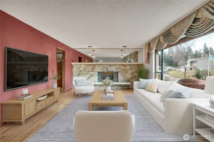 Spacious living area centered around a cozy fireplace—perfect for relaxing evenings or gathering with friends and family. **VIRTUALLY STAGED**