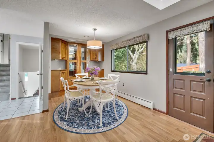 The dining room has built-ins and has enough space for a large dining room table. The skylight and picture windows flood the room with natural light! The perfect place for everyday meals or special occasion