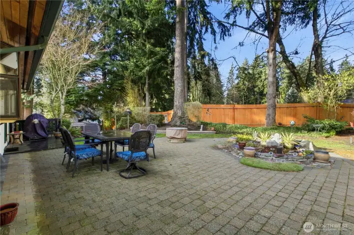 Large patio creates a wonderful outdoor living space for year-round entertaining. Gorgeous pavers add to the design. Very private too!