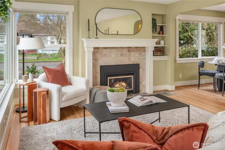 Just off the living room is the dining room and kitchen. Built-in shelving is to the right of the gas fireplace.