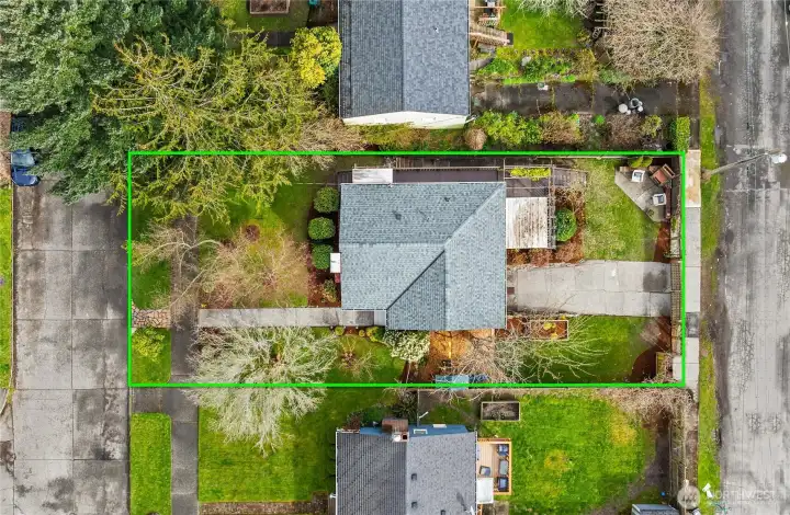 The overhead shot shows the street-to-street lot perfectly while also displaying the gorgeous yard & landscaping.