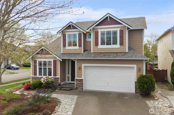 CURB APPEAL | This gracious home features a NEW roof, fresh landscaping, and a tree in the front that's stunning when it blooms. All this and in a great neighborhood that's close to everything you could want.