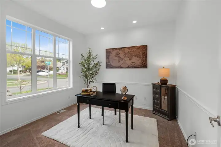 THE DEN/BONUS ROOM | You'll love the flexibility of this room located at the front of the home. Use as a home office or extra living space. The windows and new lighting make this a bright, functional space.