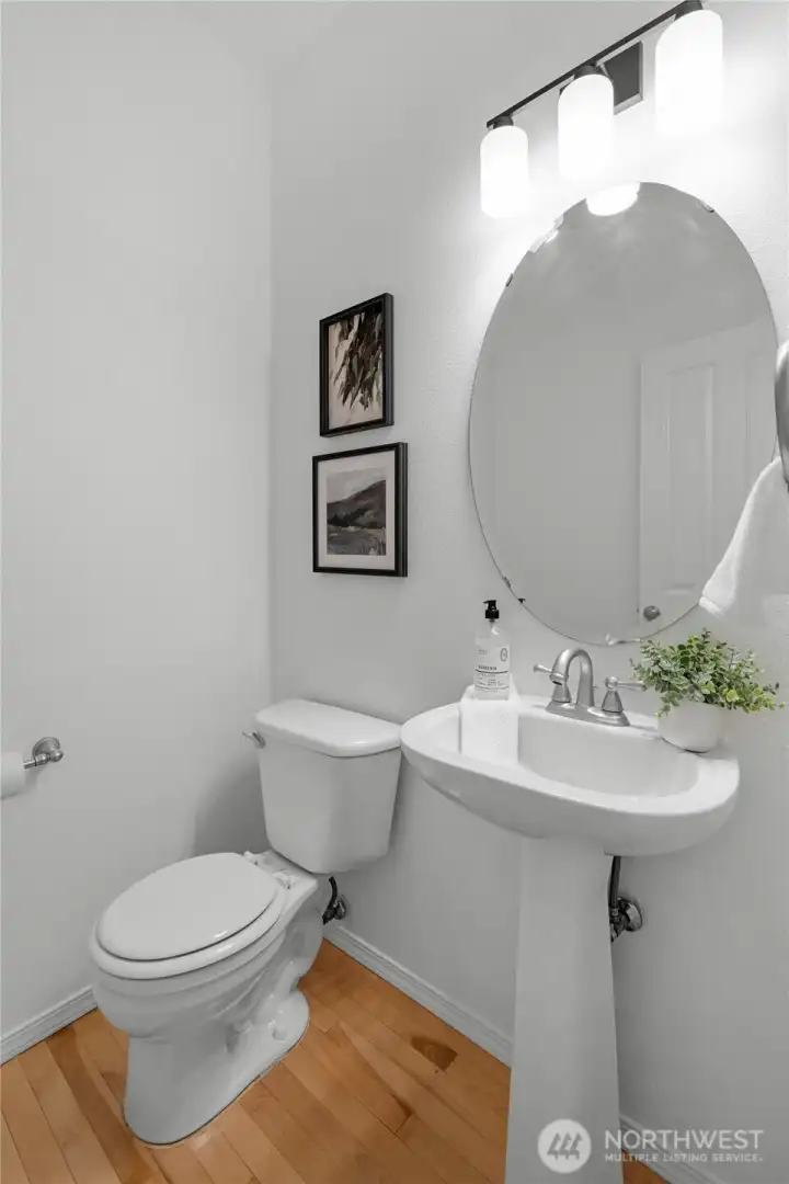 POWDER ROOM | This guest bathroom is located off the main hallway to the left just before you reach the living room.