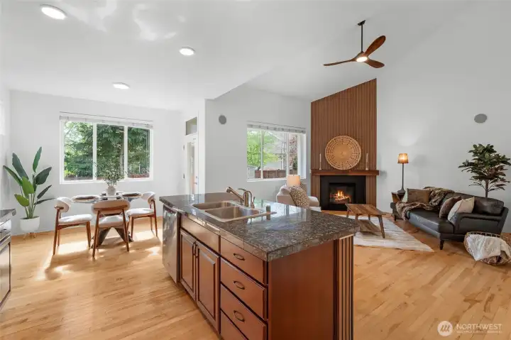 CONNECTION | You'll love the connection in this kitchen/living/informal dining area. With high ceilings, bright new lighting and abundant natural light, this space is the heart of the home.