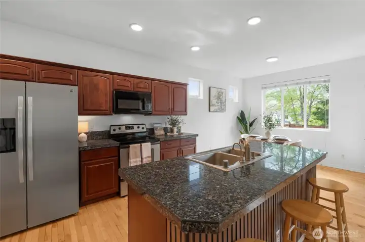 KITCHEN LOVE | This kitchen features a NEW counter-depth SS refrigerator that's sure to please with water & ice in the door.