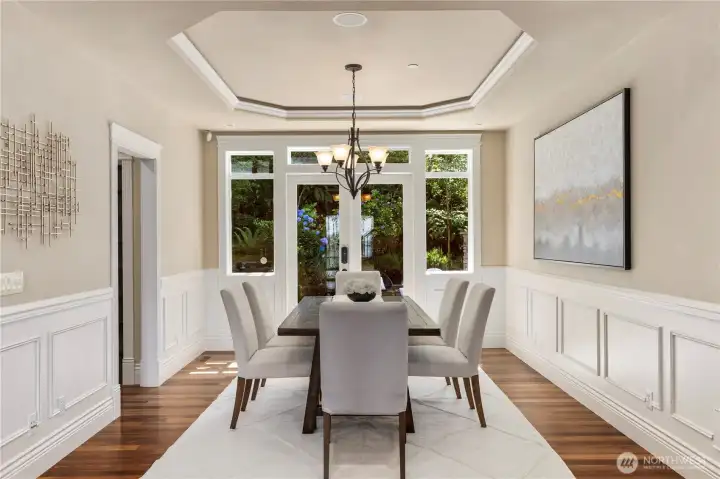 Formal dining room with French doors out to private patio with built in barbeque.