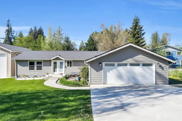 Front exterior showcasing driveway and entry