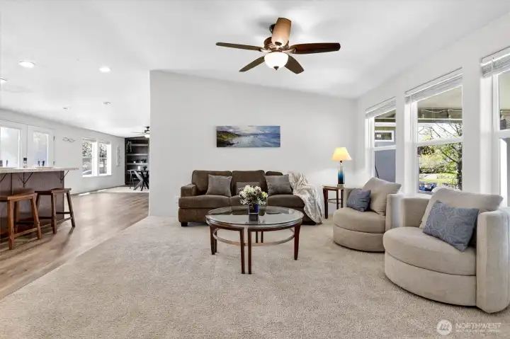 Open concept living room with large windows