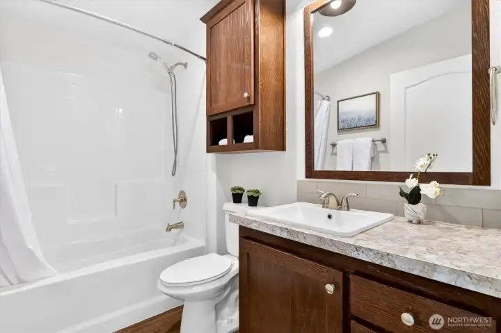 Bathroom with vanity and mirror