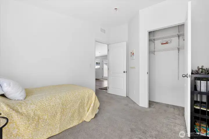 Bedroom with closet space and neutral palette