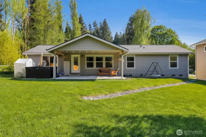 Backyard view featuring home exterior