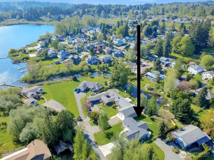 Aerial showcasing nearby lake and community