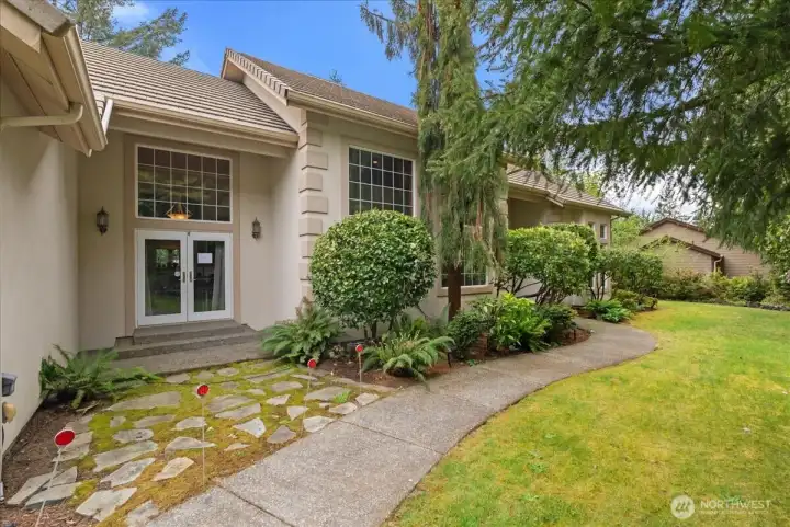 Nestled among evergreens, this home offers exceptional tranquility and seclusion.