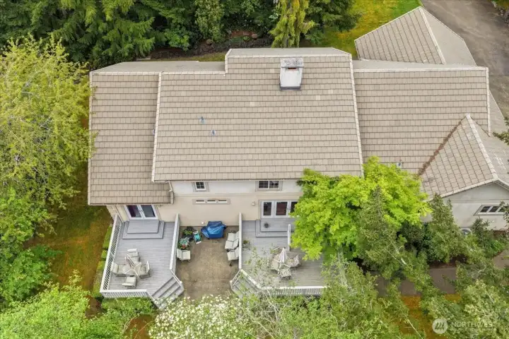 Peaceful aerial view showcases privacy, mature trees, and natural beauty.