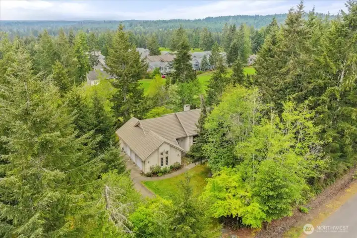 Exceptional golf course living surrounded by lush fairways and mature evergreens.