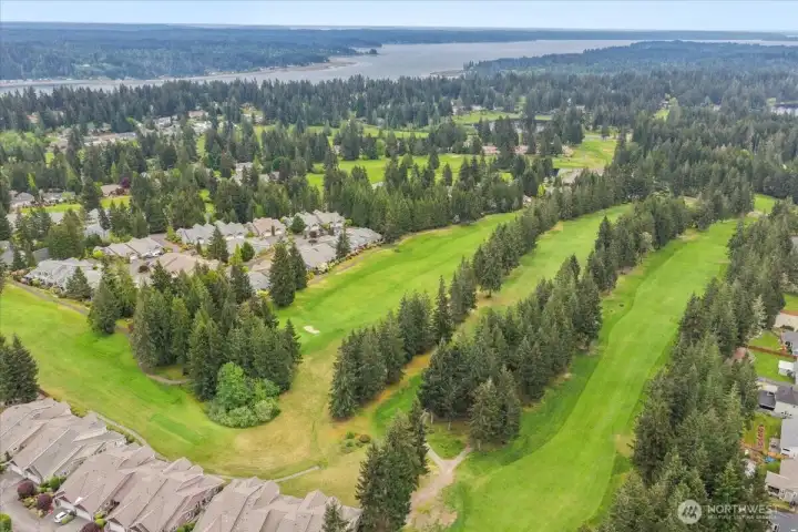 Nestled near the fairways, offering tranquil golf course lifestyle opportunities daily.