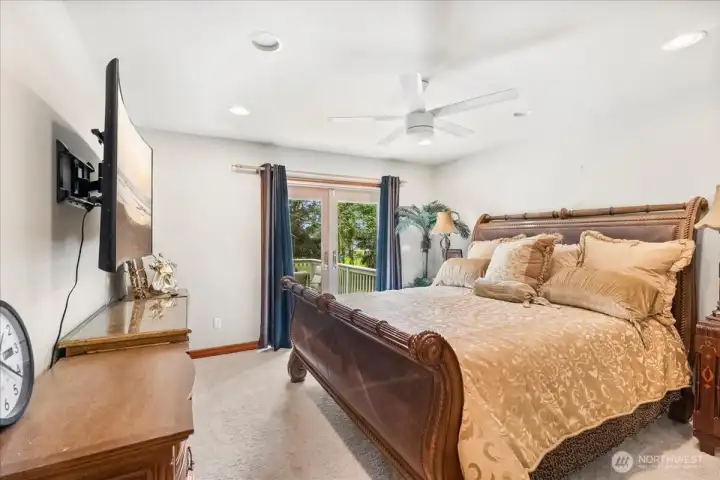 Spacious primary suite offers comfort, privacy, and relaxing retreat atmosphere.