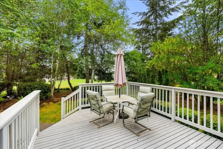 Surrounded by towering evergreens, offering exceptional privacy and peaceful living.